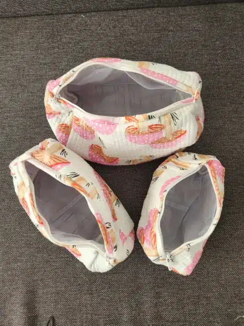 Sundari Indian toilet bag - all three sizes open on a grey textile background